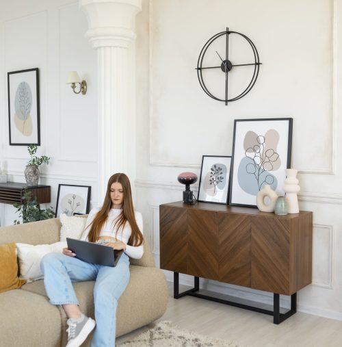 woman-using-laptop-minimal-decorated-room